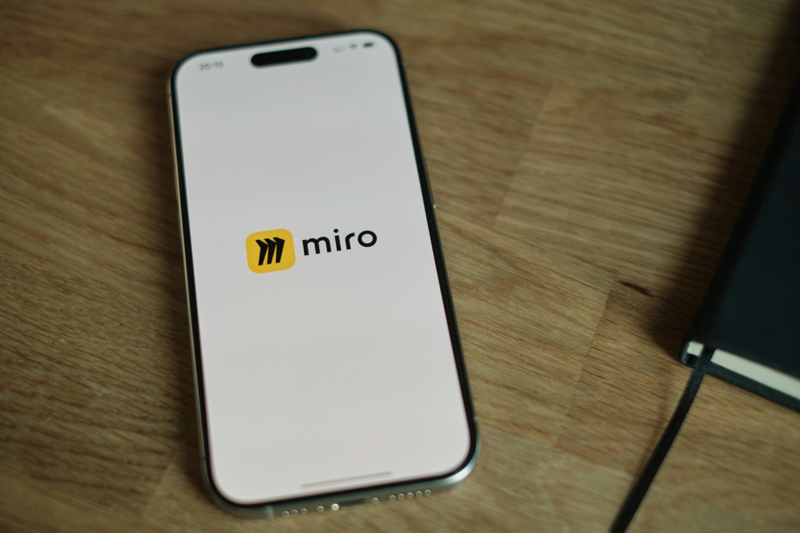Cell phone with the Miro logo on the screen