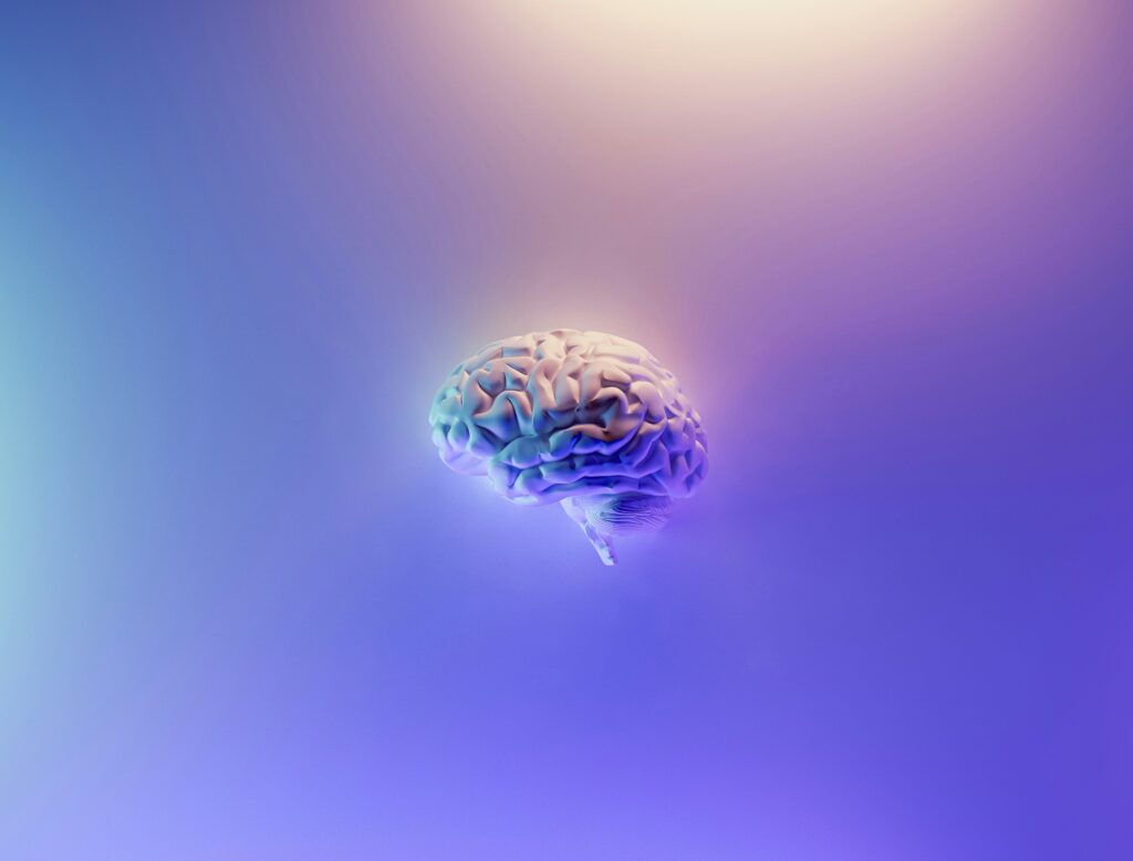 3d rendering of a brain in iridescent pastel colors