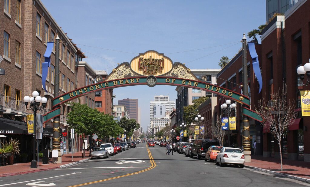 An arch stretches across the street with a sign reading "Gaslamp Quarter: Historic Heart of San Diego"