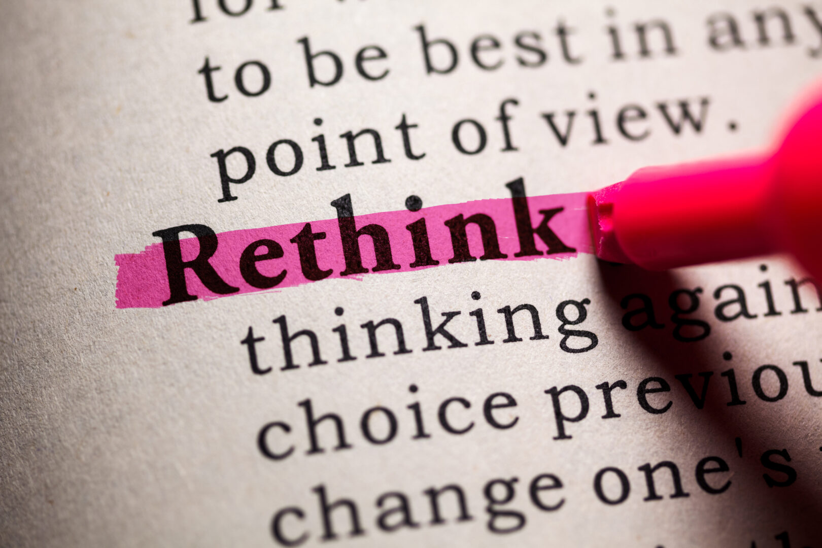 Closeup of a dictionary page where the work "Rethink" is highlighted in pink.