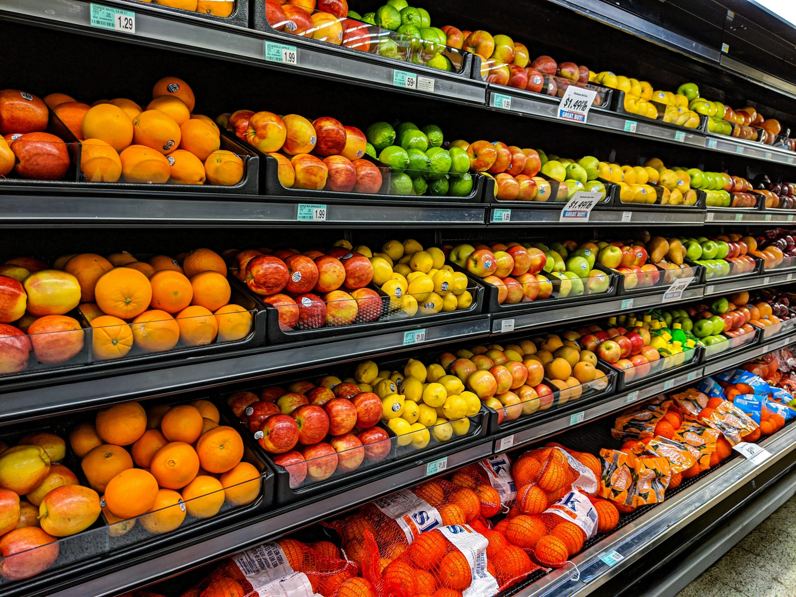 Fresh fruit stocked in the produce aisle of a grocery store