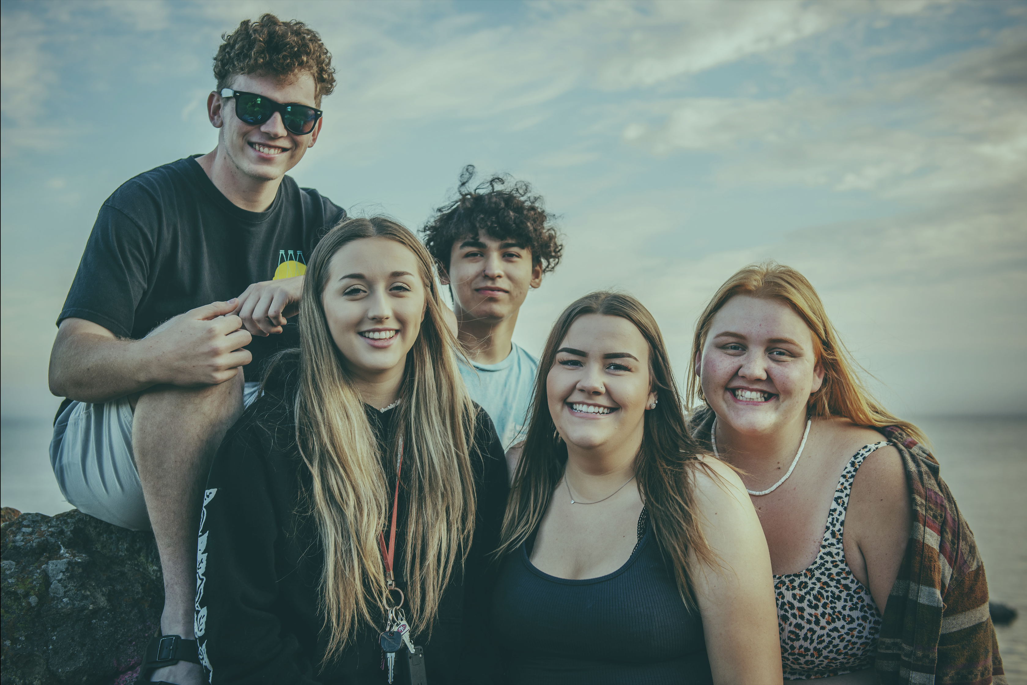 Group of teens on the beach Image of computer screen, logged into WordPress, with backend screen to create a new post.